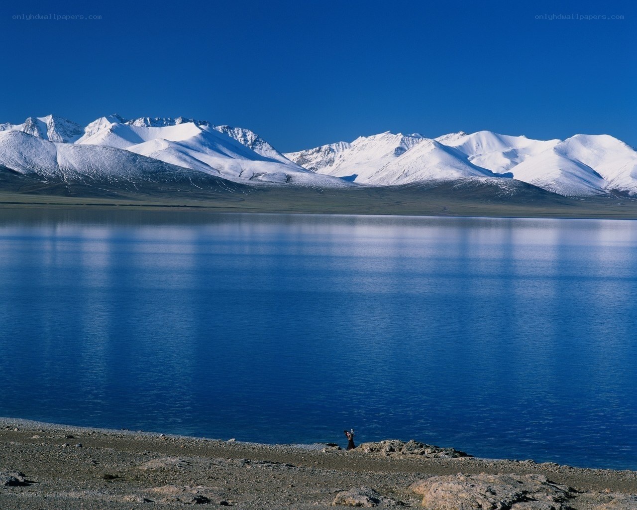 Lake with snow-capped mountains