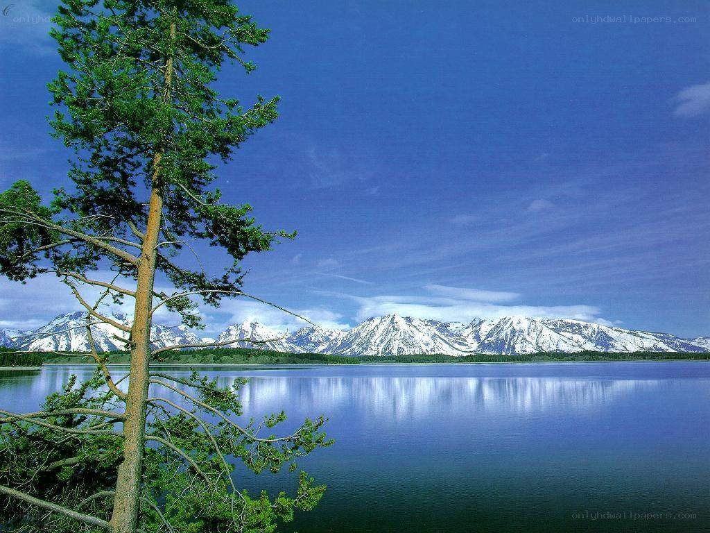 Lake with snow-capped mountains