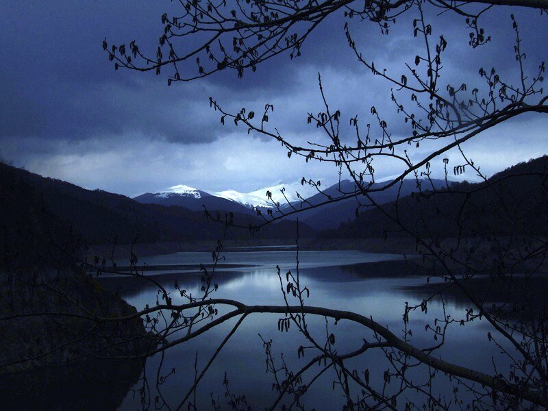 Lake with snow-capped mountains
