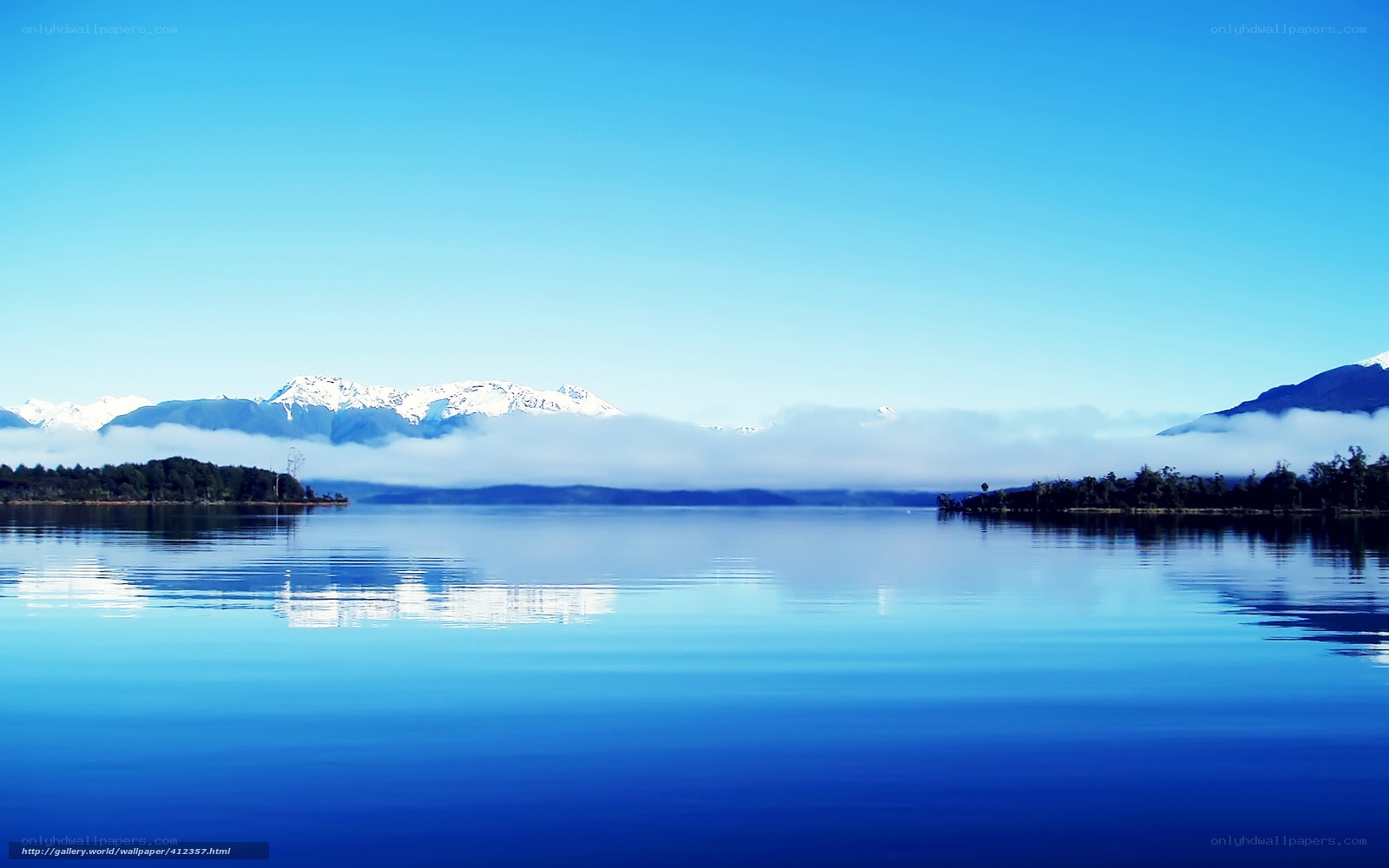 Lake with snow-capped mountains