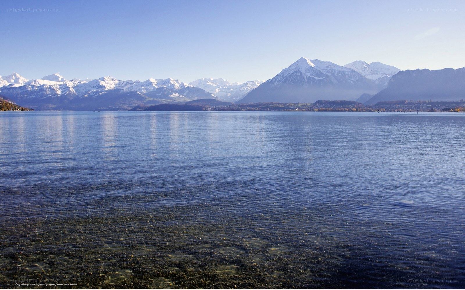 Lake with snow-capped mountains