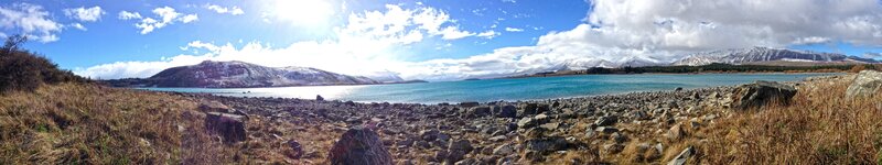 Lake with Snow-capped Mountains — Blue, Serene, Afternoon, Photograph, Rocks