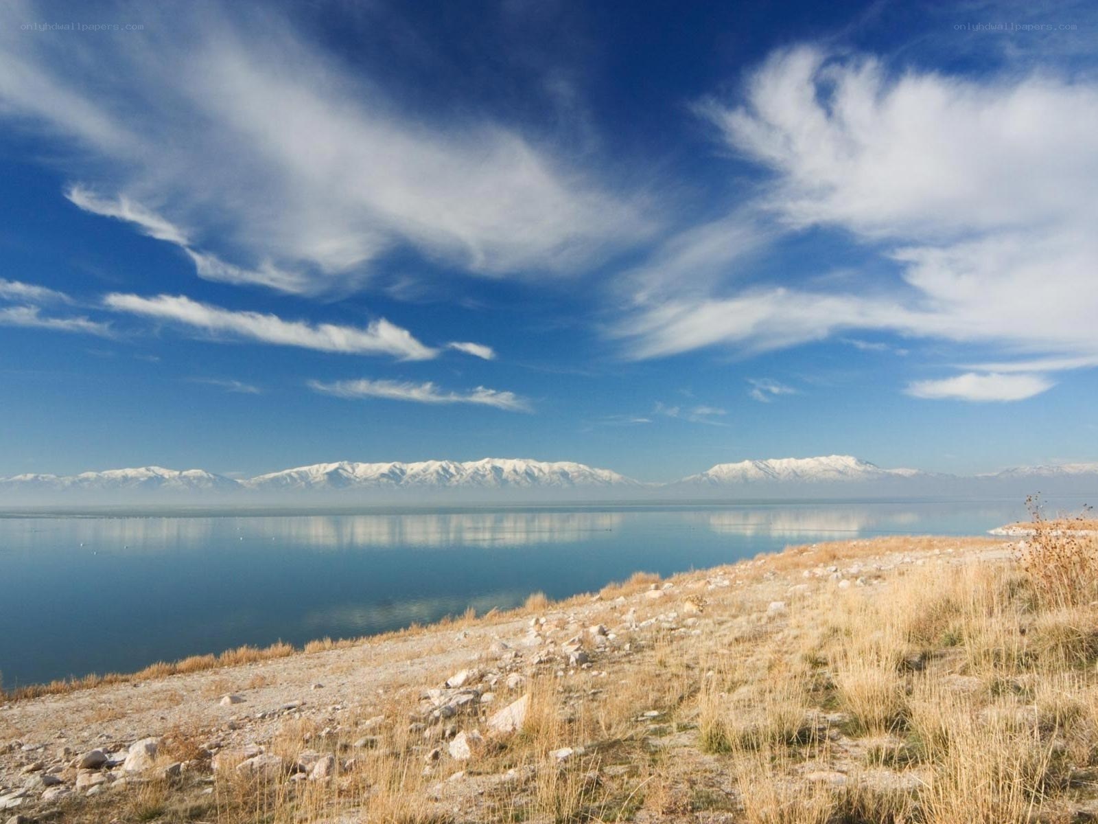 Lake with snow-capped mountains
