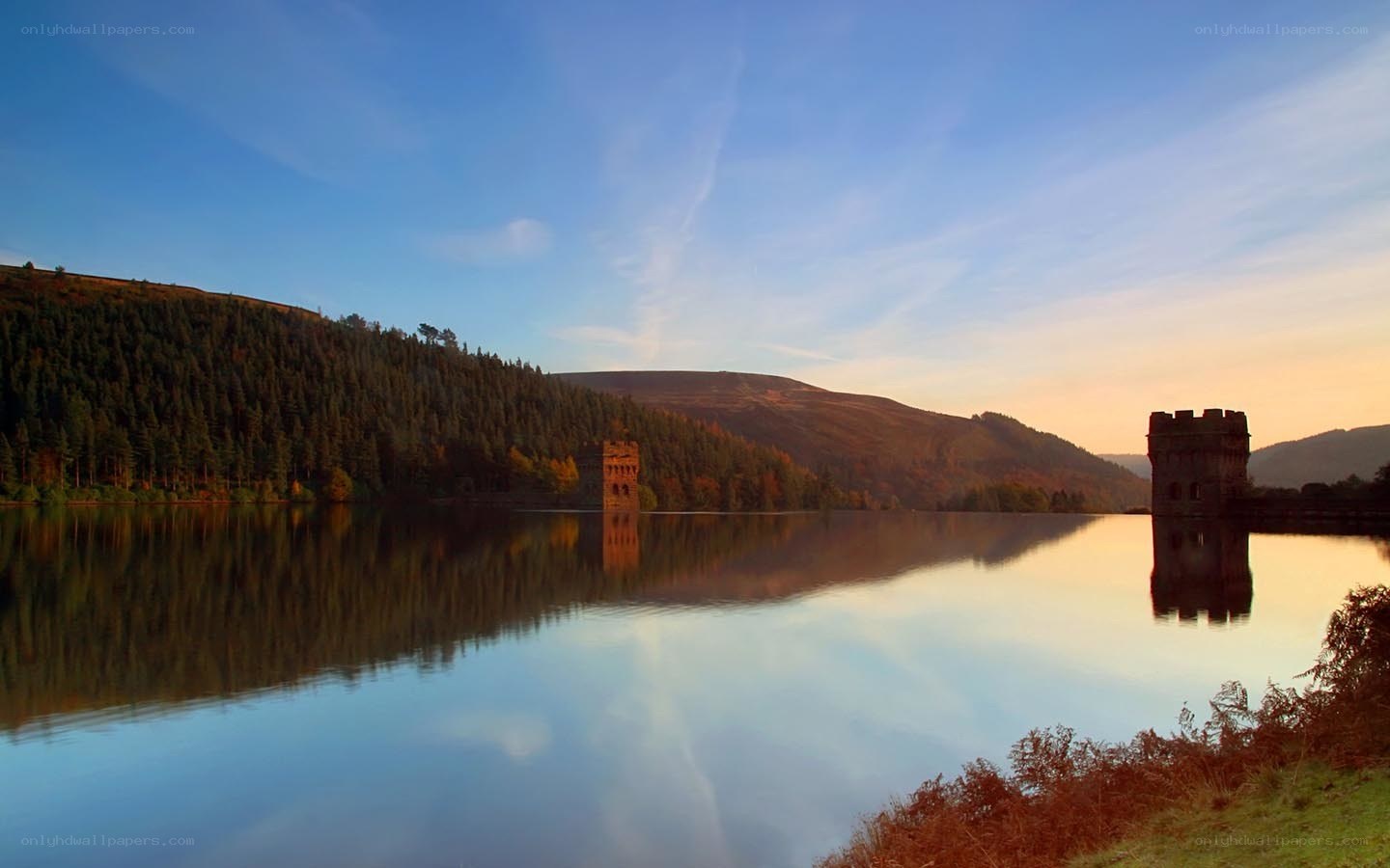 Lake with towers at sunset