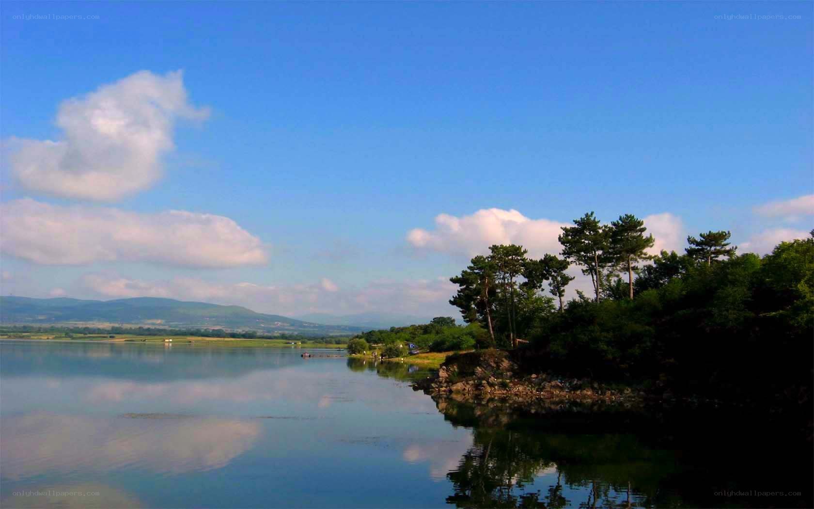 Lake with trees and mountains