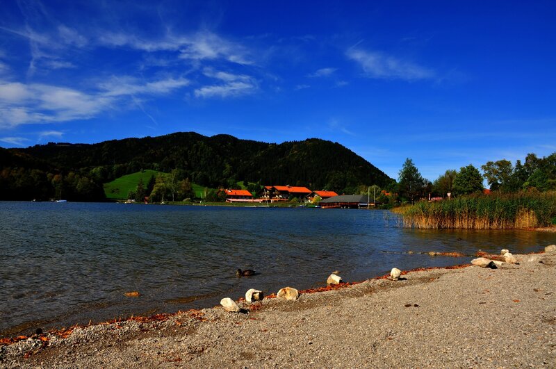 Lake with village and mountains