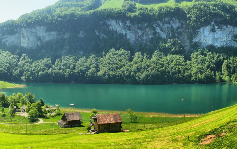 Lake with Wooden Cabins — Green, Serene