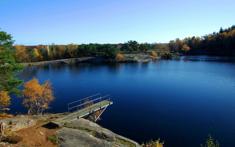 Lake with wooden dock in autumn
