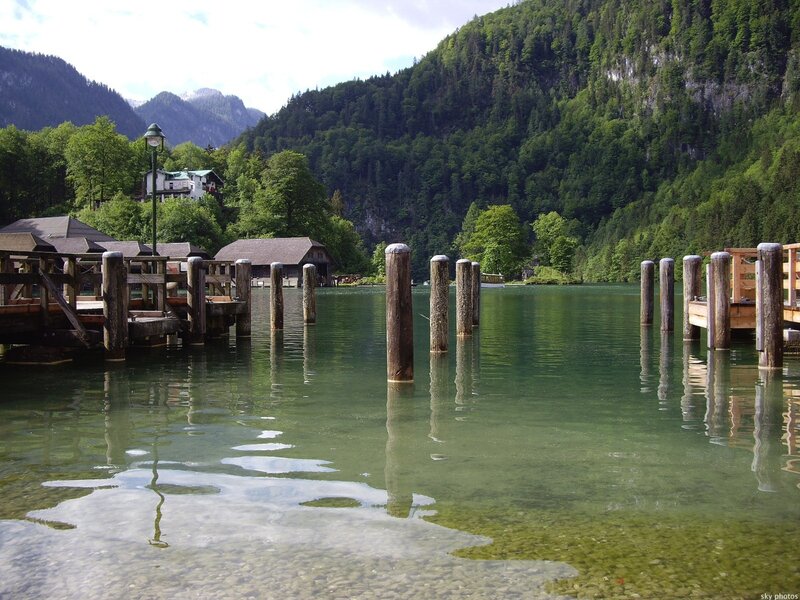Lake with wooden docks and mountains