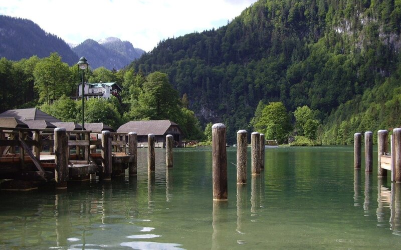 Lake with wooden docks and mountains