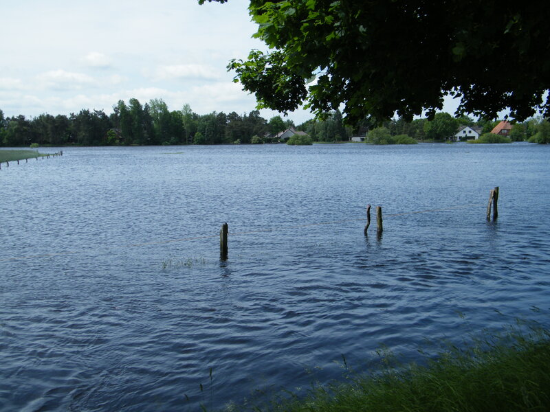 Lake with Wooden Posts — Blue, Calm
