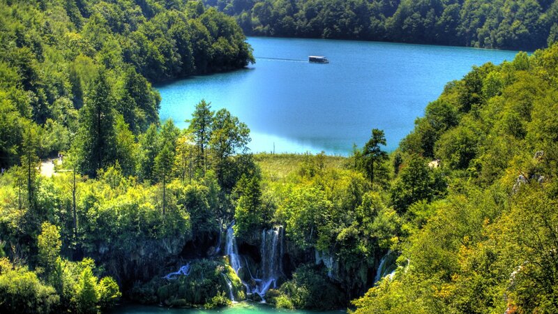 Lakeside forest with waterfalls