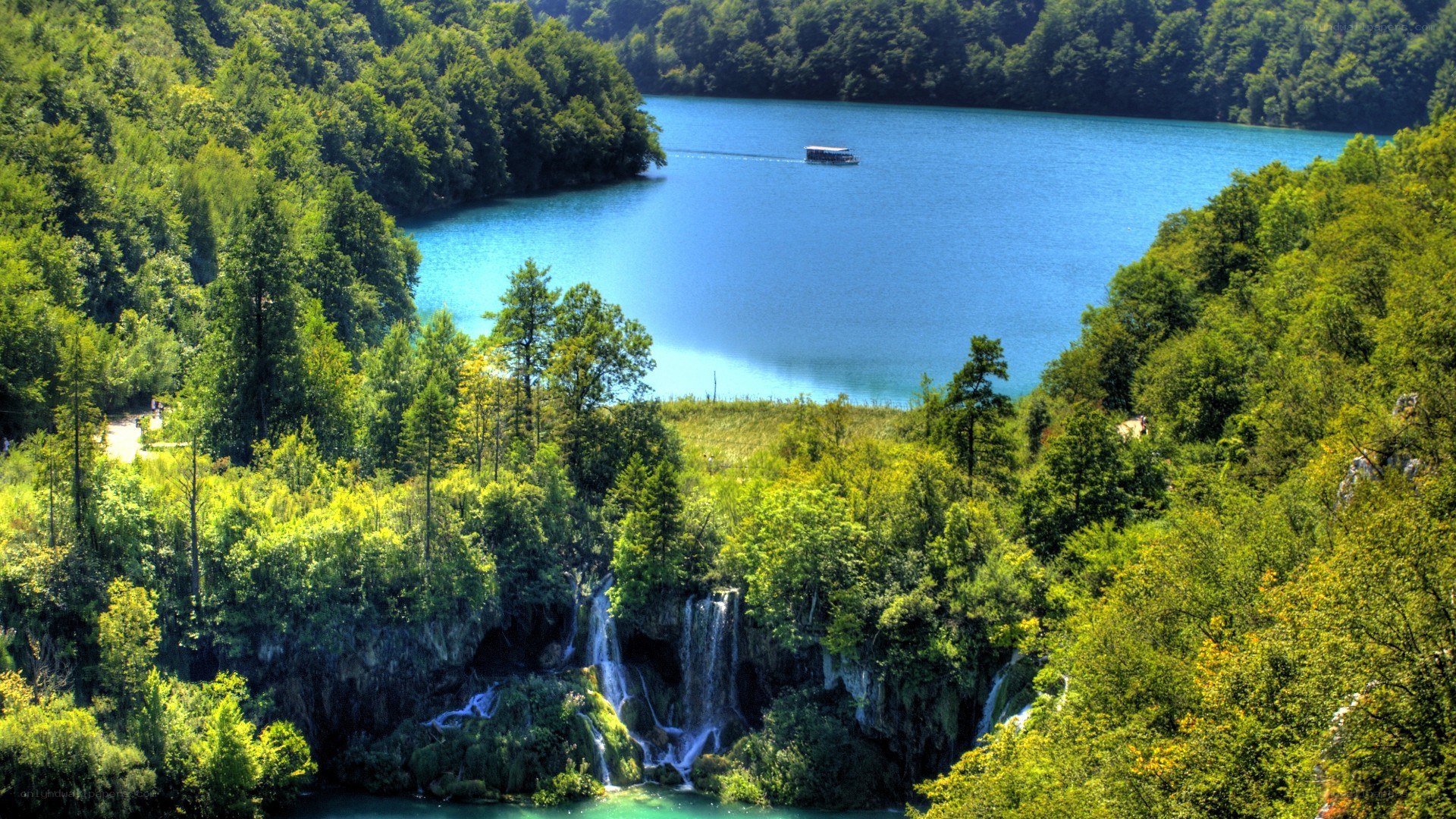 Lakeside forest with waterfalls