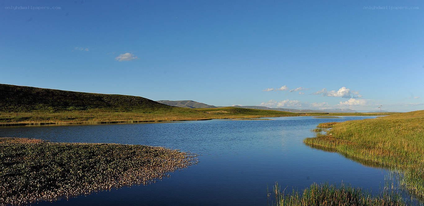 Lakeside landscape with hills
