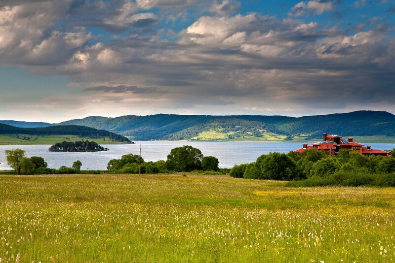 Lakeside landscape with house