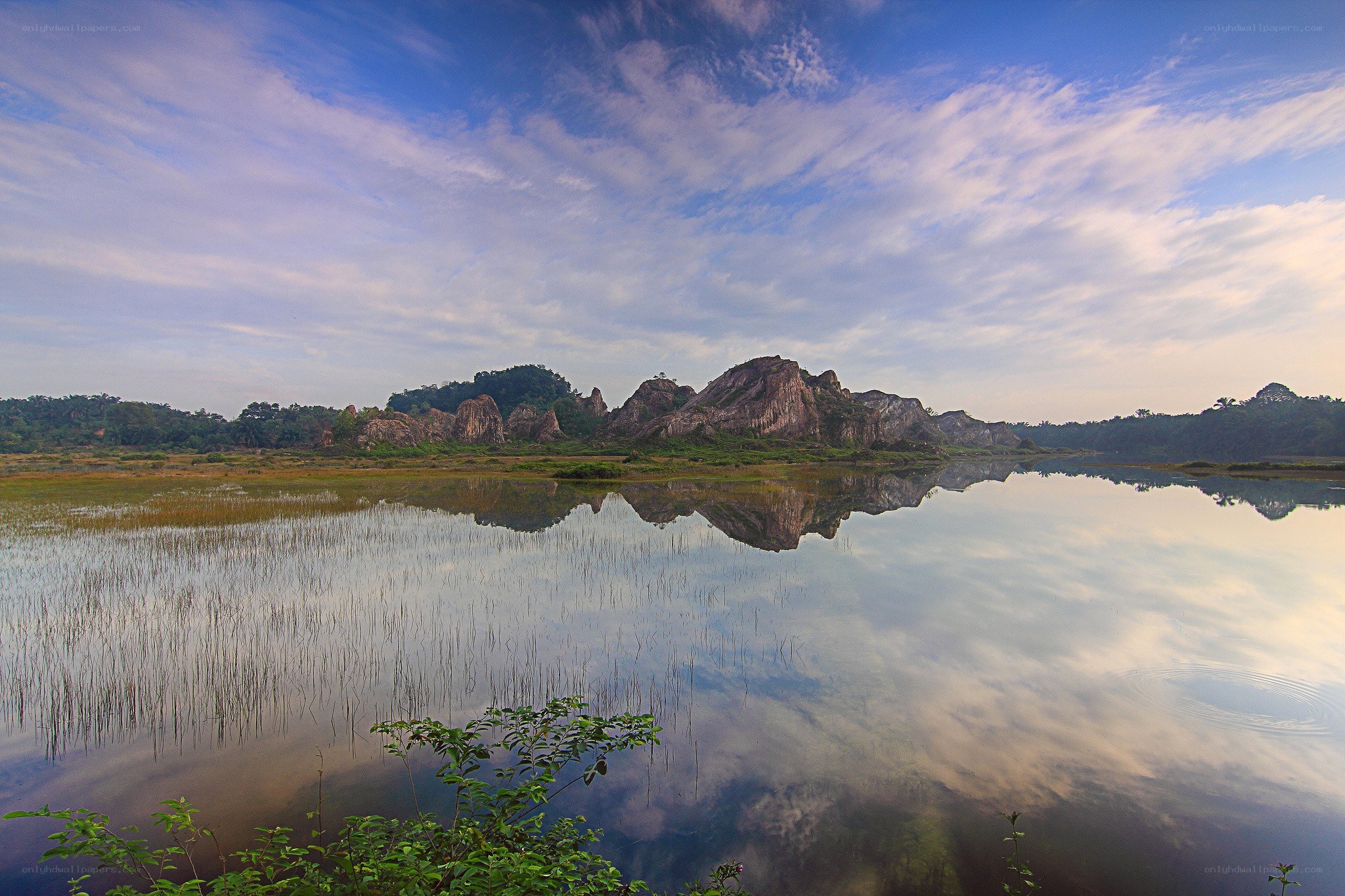 Lakeside rock formations at dawn