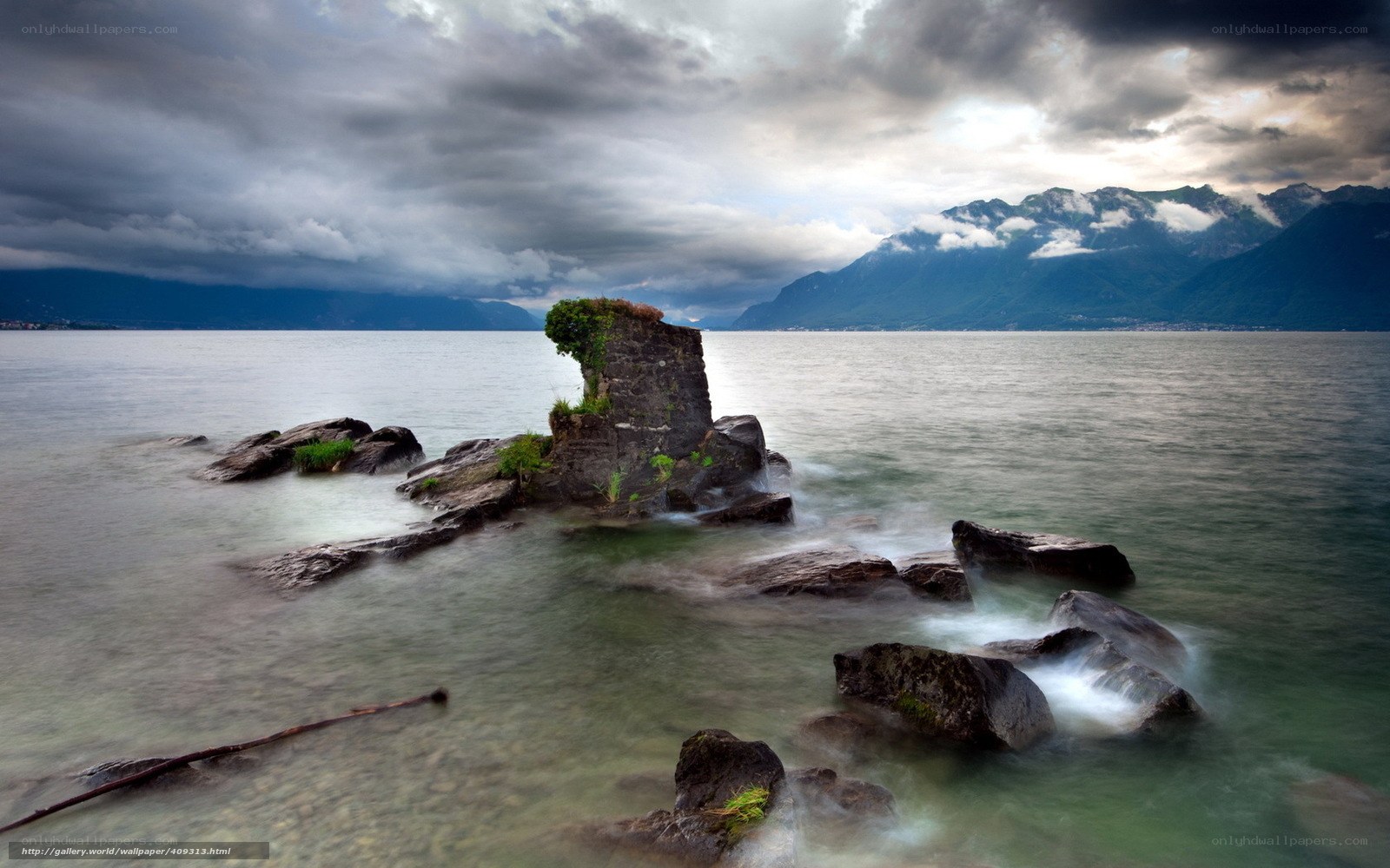 Lakeside ruins under stormy sky