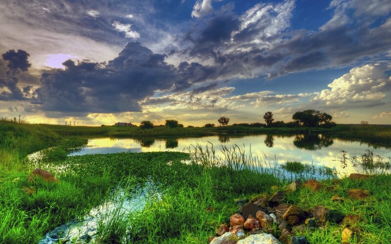 Lakeside sunset with dramatic clouds
