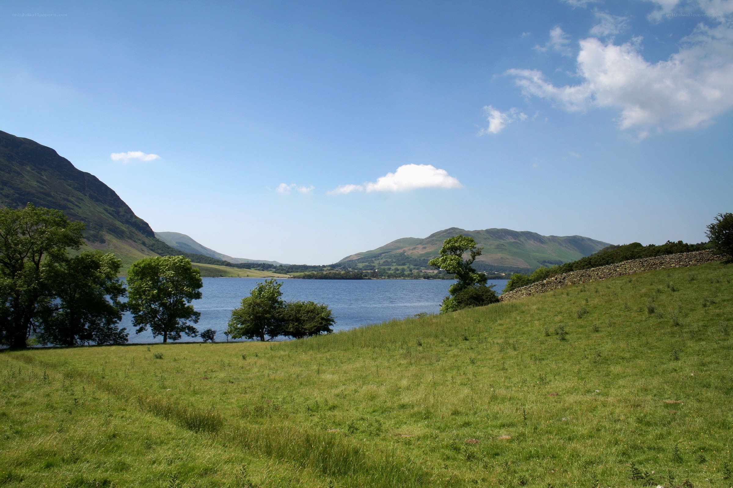 Lakeside view with hills