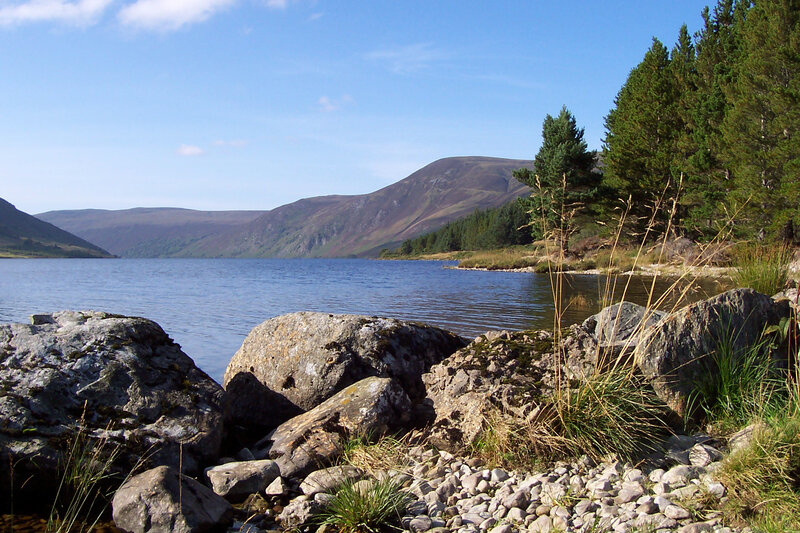 Lakeside with mountains in background