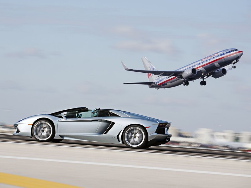 Lamborghini and airplane on runway