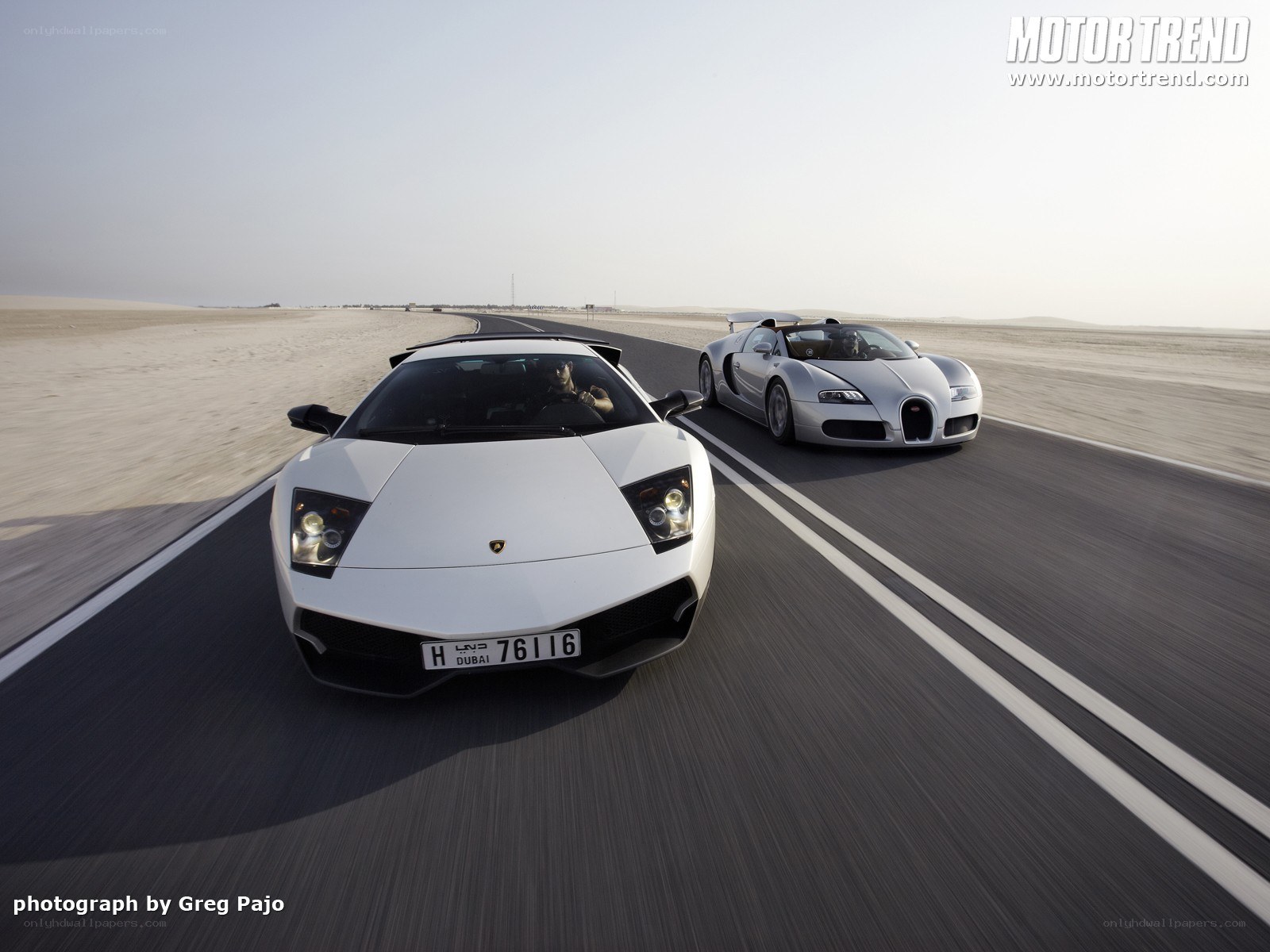 Lamborghini and Bugatti on desert road