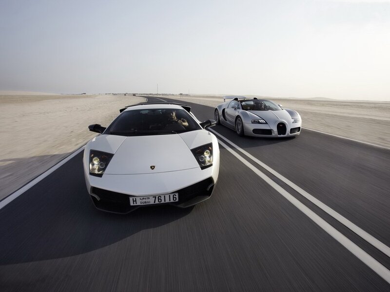 Lamborghini and Bugatti on desert road