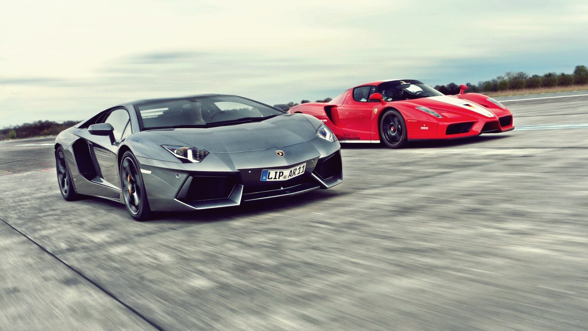 Lamborghini and Ferrari on track