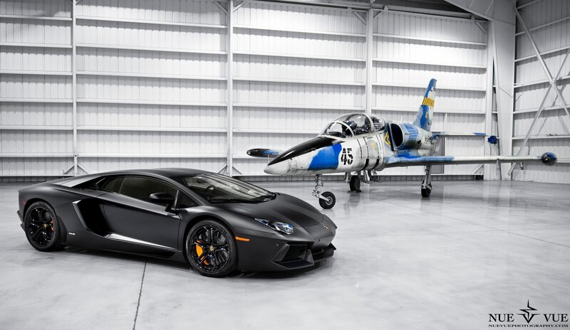 Lamborghini and jet in hangar
