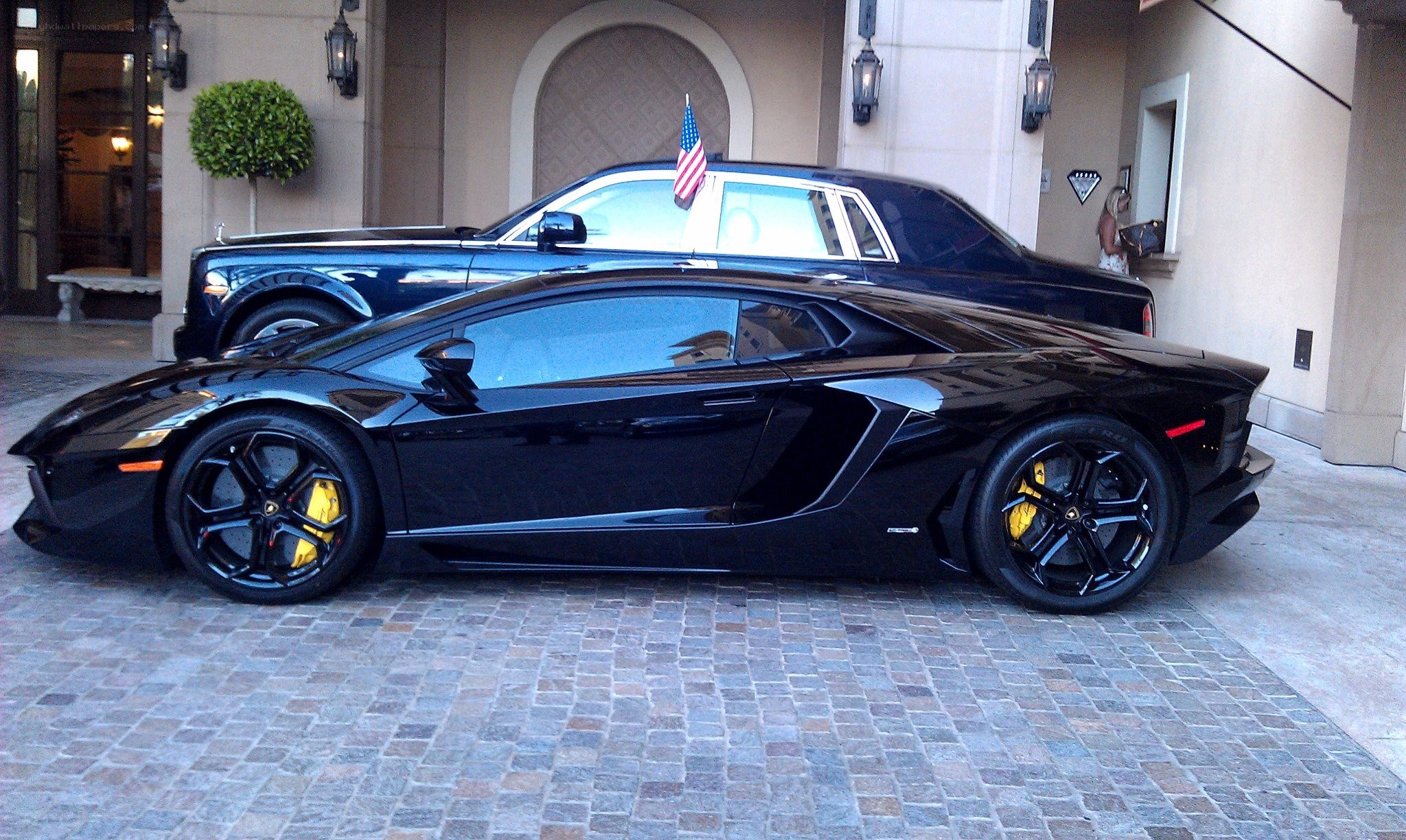 Lamborghini and Rolls-Royce at hotel