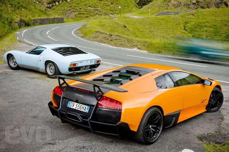 Lamborghini cars on a winding road