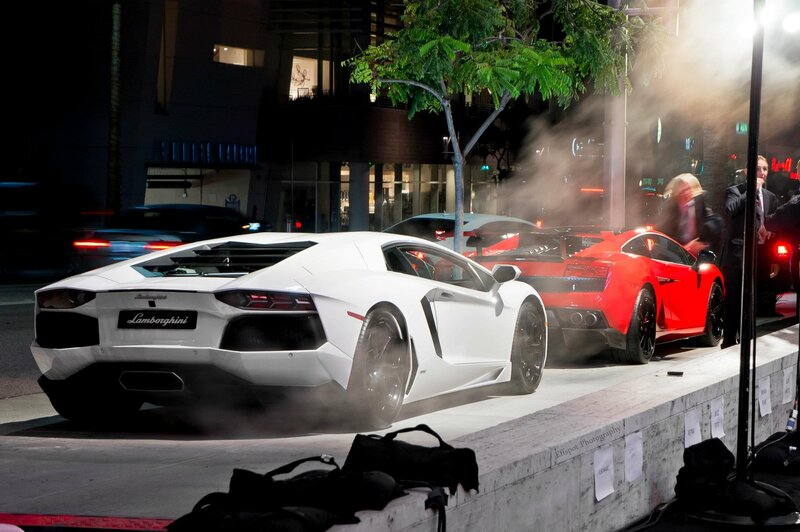 Lamborghini cars on display at night