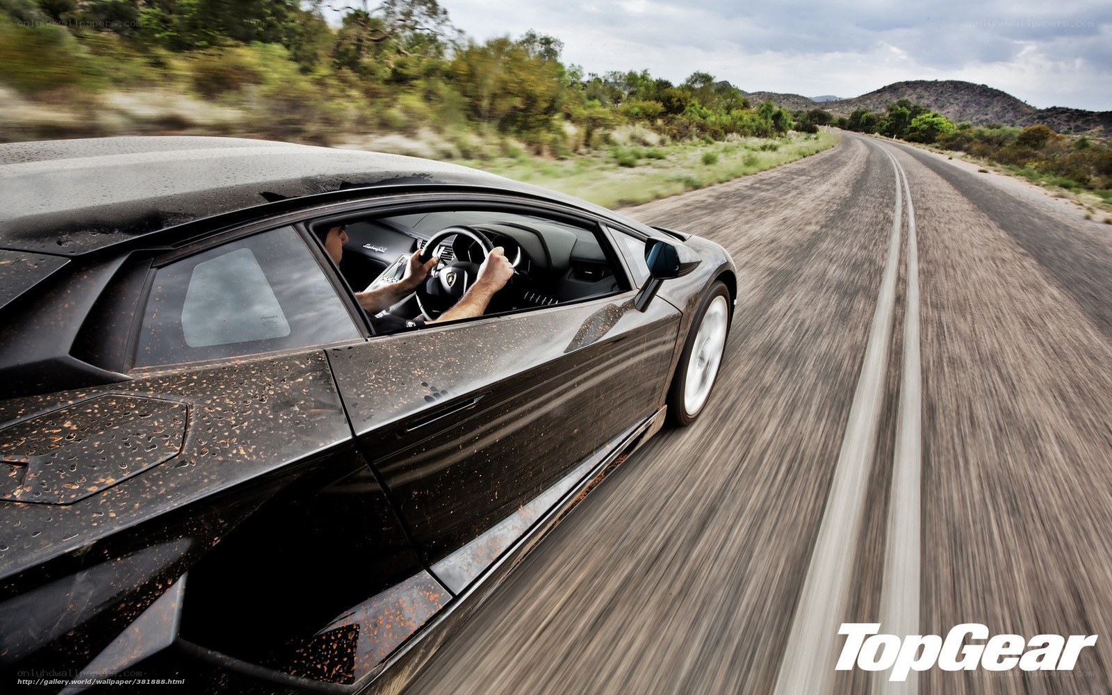 Lamborghini driving on a dirt road