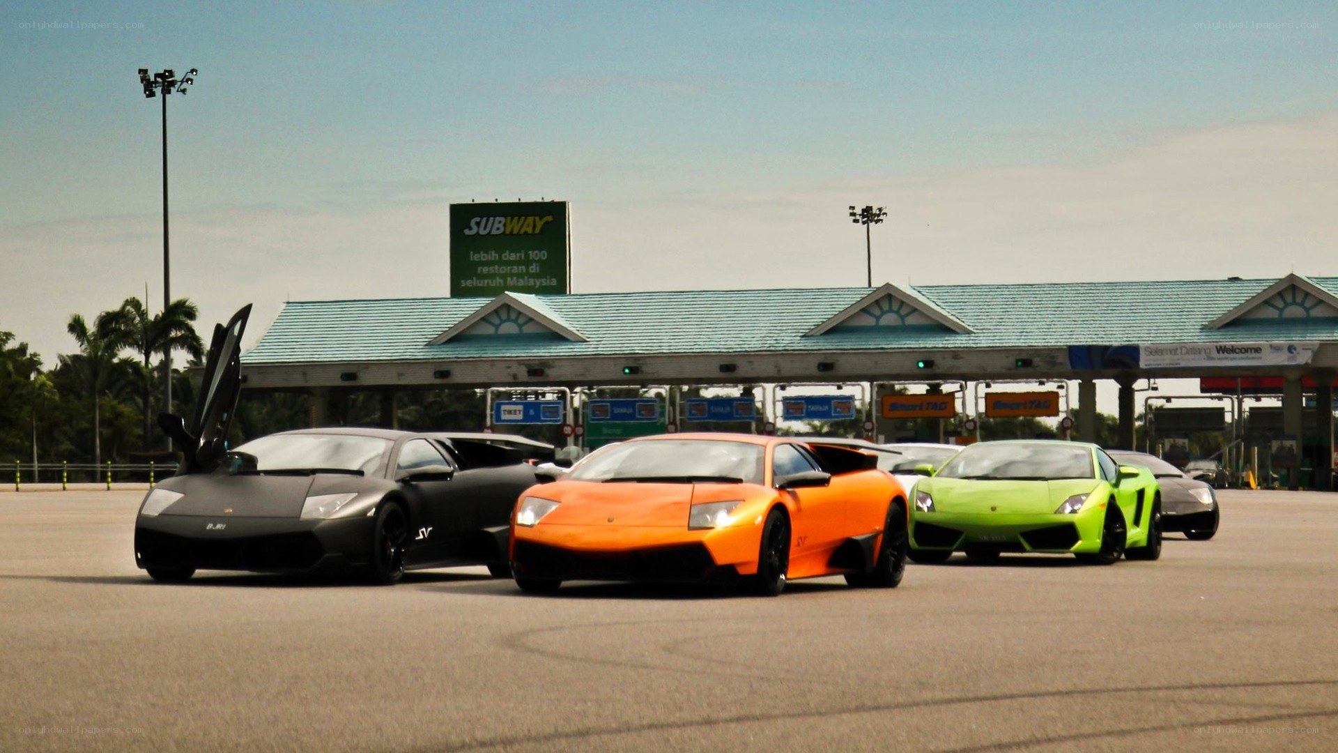 Lamborghini lineup at toll plaza
