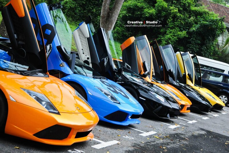 Lamborghini lineup with open doors