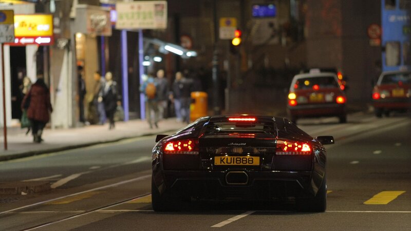 Lamborghini on city street at night
