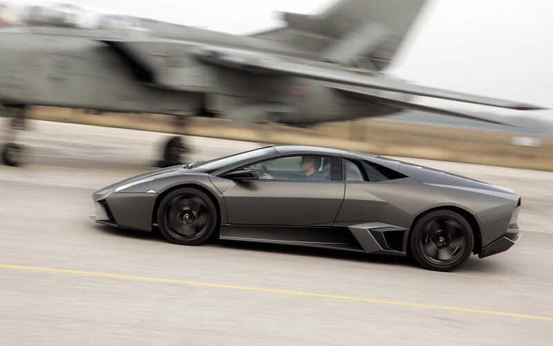 Lamborghini on runway with jet