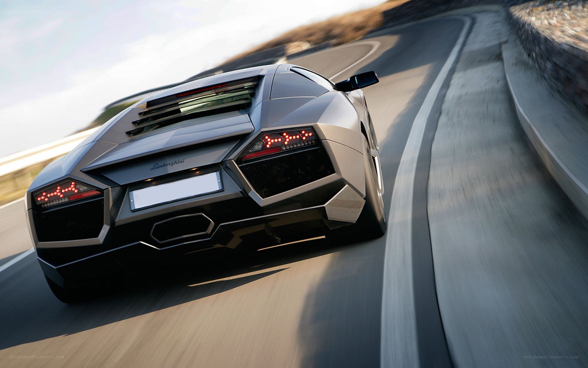 Lamborghini speeding on a winding road