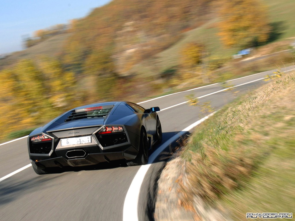 Lamborghini speeding on a winding road