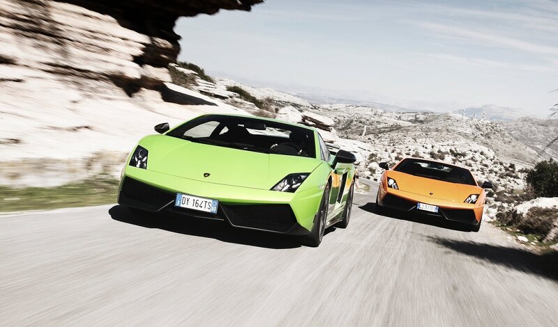 Lamborghini sports cars on mountain road