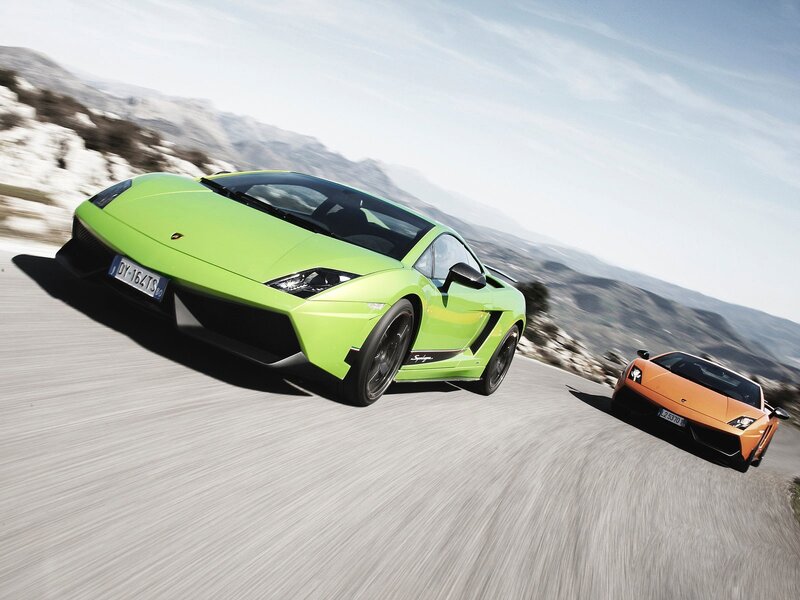 Lamborghini sports cars on mountain road