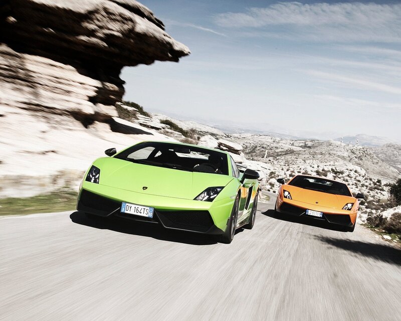 Lamborghini sports cars on mountain road
