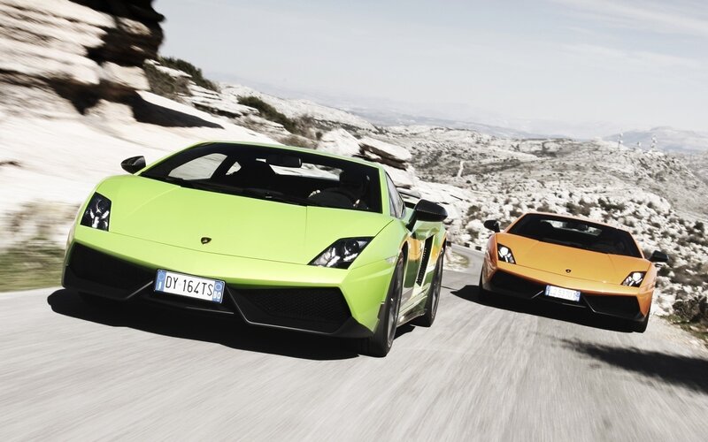 Lamborghini sports cars on mountain road