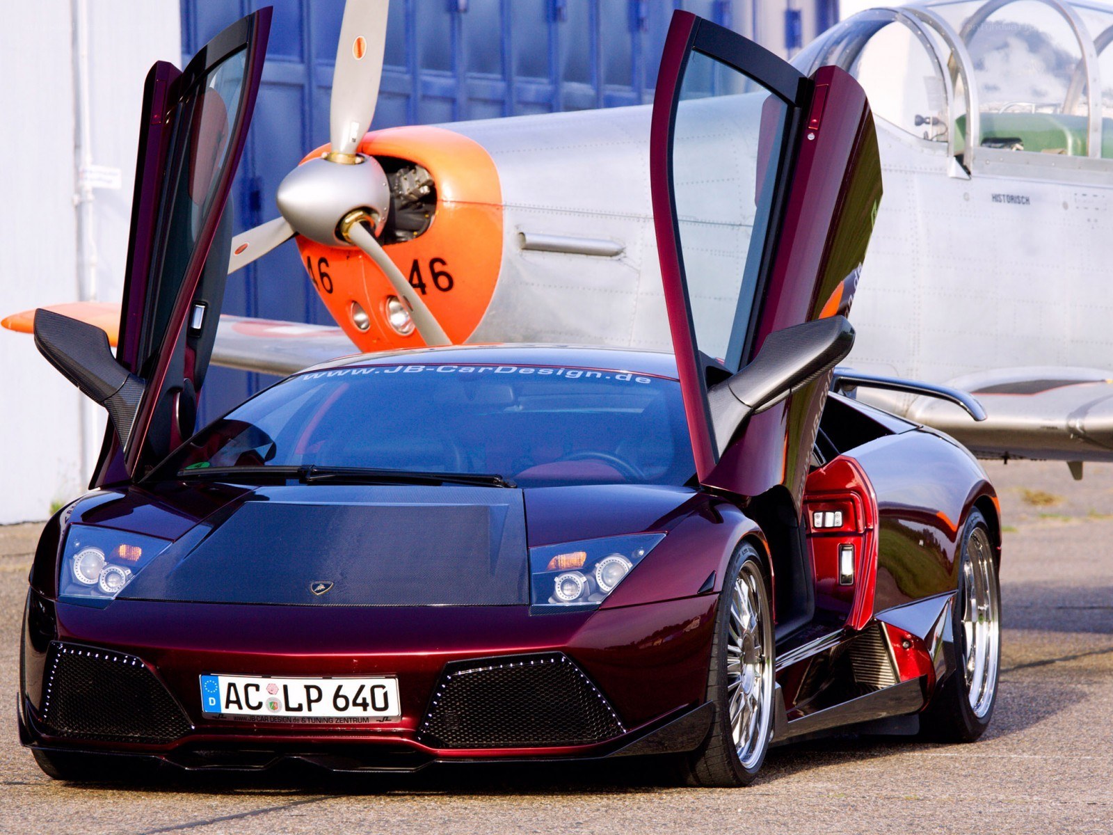 Lamborghini with airplane in background