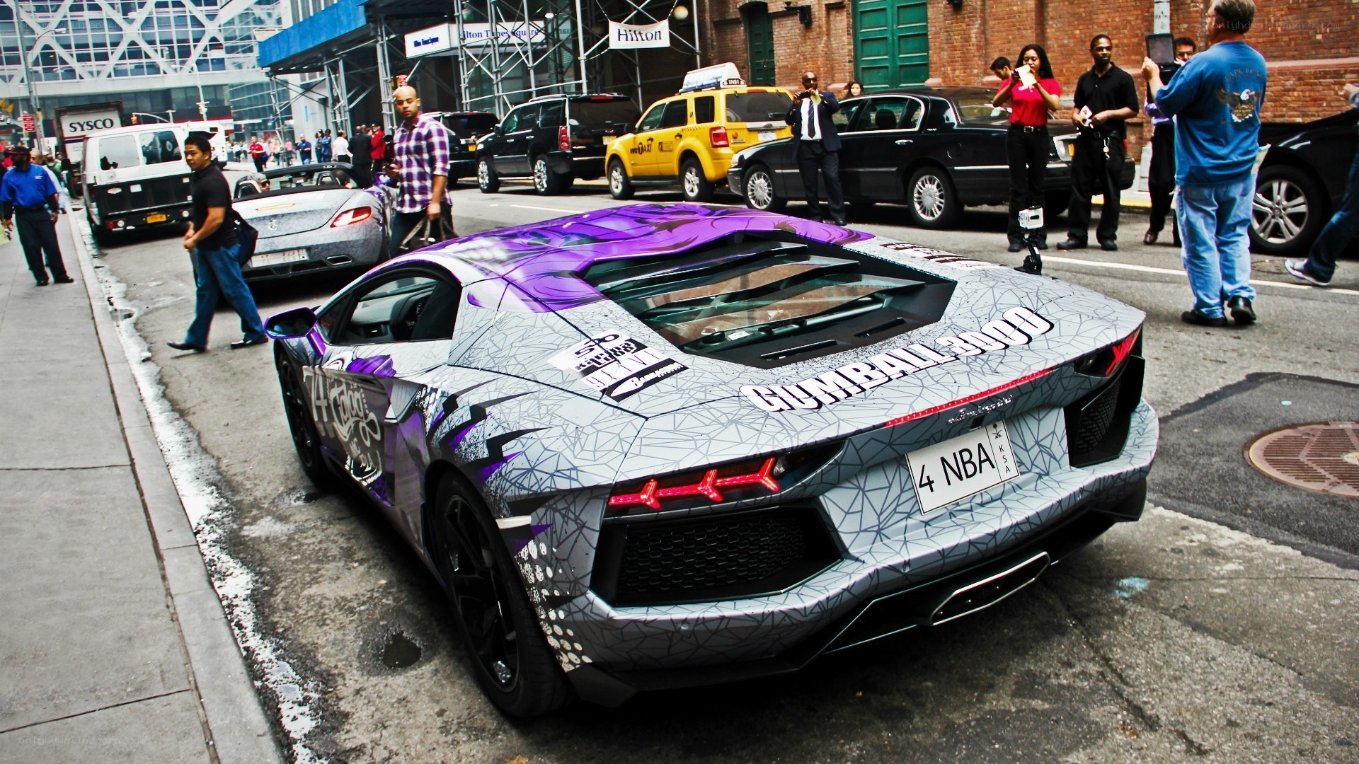 Lamborghini with custom wrap on city street