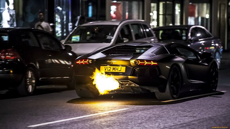 Lamborghini with flames at night