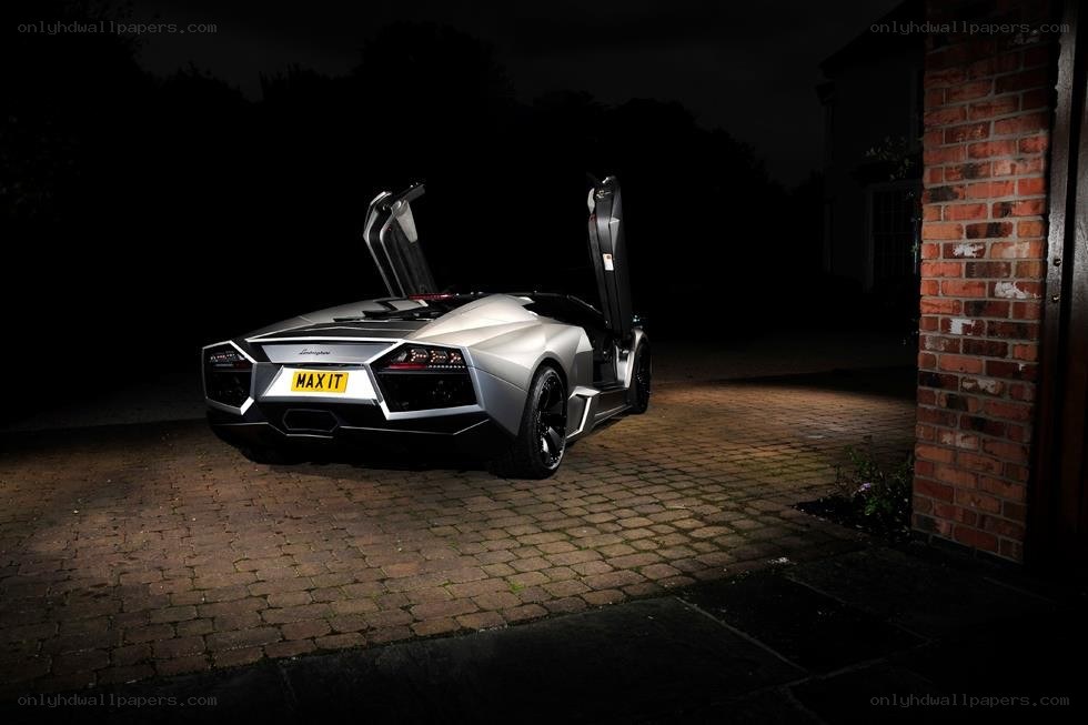 Lamborghini with open doors at night
