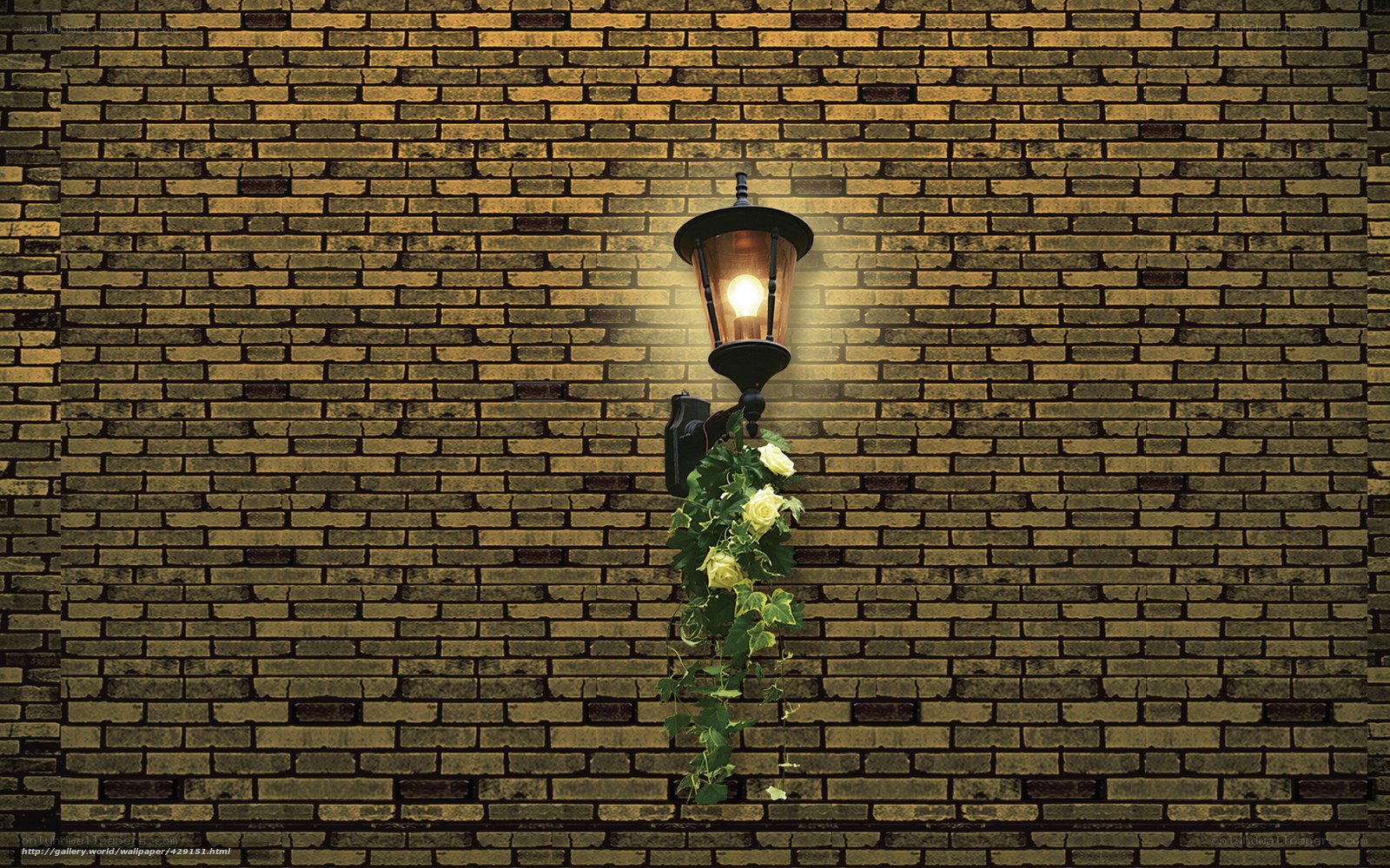 Lamp on brick wall with flowers