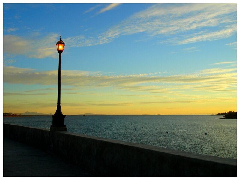 Lamp post at sunset by the water