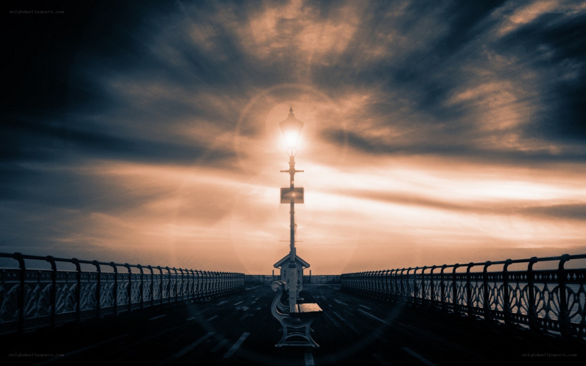 Lamp post at sunset on pier